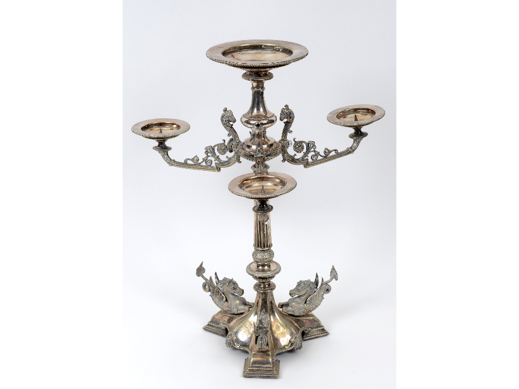 An Elkington style silver plated table centrepiece, decorated rams head masks,