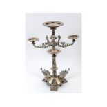 An Elkington style silver plated table centrepiece, decorated rams head masks,