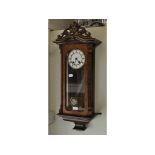 A Vienna style wall clock, in a walnut case, 77 cm high, an inlaid mantle clock,