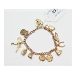 A 9ct gold charm bracelet, with assorted 9ct gold charms, approx. 17.