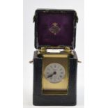 A brass carriage clock, modern,