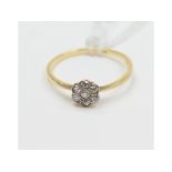 An 18ct gold and diamond flowerhead ring, approx.