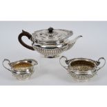 A Victorian silver three piece tea set, of compressed circular form, London 1897, approx. 30.