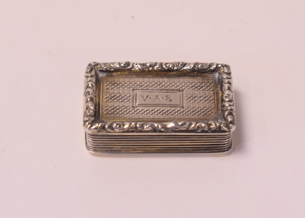A George IV silver vinaigrette, initialled, with engine turned and applied floral decoration,