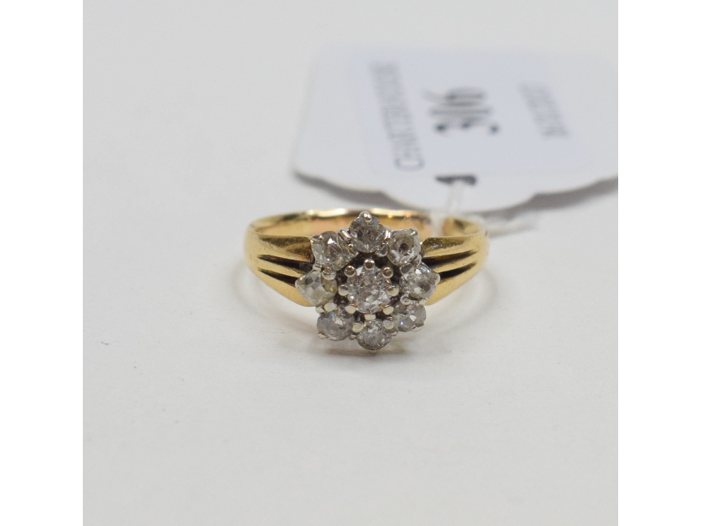 An 18ct gold and diamond flowerhead ring, approx.