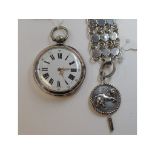EXTRA LOT: A silver open face pocket watch, the back with engraved decoration of two horses,