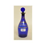 A 19th century blue glass decanter and stopper, having a gilt label Brandy,