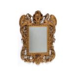 An Italian carved giltwood frame, inset a mirror,