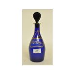 A 19th century blue glass decanter and stopper, having a gilt label Hollands,