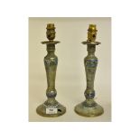 A pair of champleve enamel candlesticks, drilled and wired for electricity,