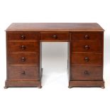 A mahogany desk, having an arrangement of nine drawers,