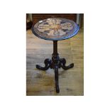 A Victorian walnut tripod table, the top with marquetry inlaid decoration,