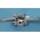 An 18ct white gold and solitaire diamond ring, set a princess cut stone, approx.