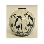 A pottery vase, decorated penguins, of spherical form,