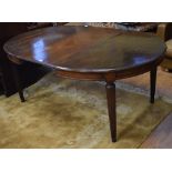 A mahogany D end extending dining table, inset three extra leaves, on fluted tapering legs,