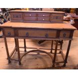 A Warings oak desk, having three freize drawers and a superstructure,