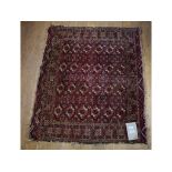 A Tekke Turkoman Juval rug, decorated motifs on a red ground, within a multi border,