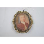 An oval portrait miniature, of a gentleman with grey ringlets, watercolour, 5.5 x 4.