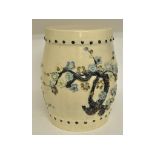 A Chinese pottery barrel shaped stool, decorated flowers and foliage,