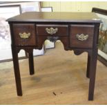 A 19th century mahogany lowboy, having three frieze drawers,