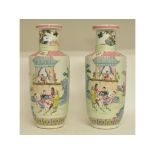 A pair of Chinese famille rose style vases, decorated figures,