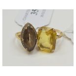 A 9ct gold and smokey quartz dress ring, approx. ring size K½, and another similar, approx.