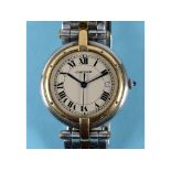 A lady's bi-metal Cartier wristwatch, the white dial with date aperture,