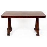 An early Victorian rosewood centre table, on lotus leaf capped tapering circular legs,