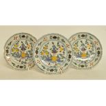 A set of three 19th century Dutch Delft polychrome plates,