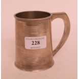 A silver mug, inscribed, Birmingham 1935, approx. 7.5 ozt, 9.