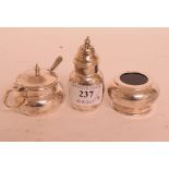 A silver three piece cruet set, Adie & Bros, London 1941, and an associated salt spoon,