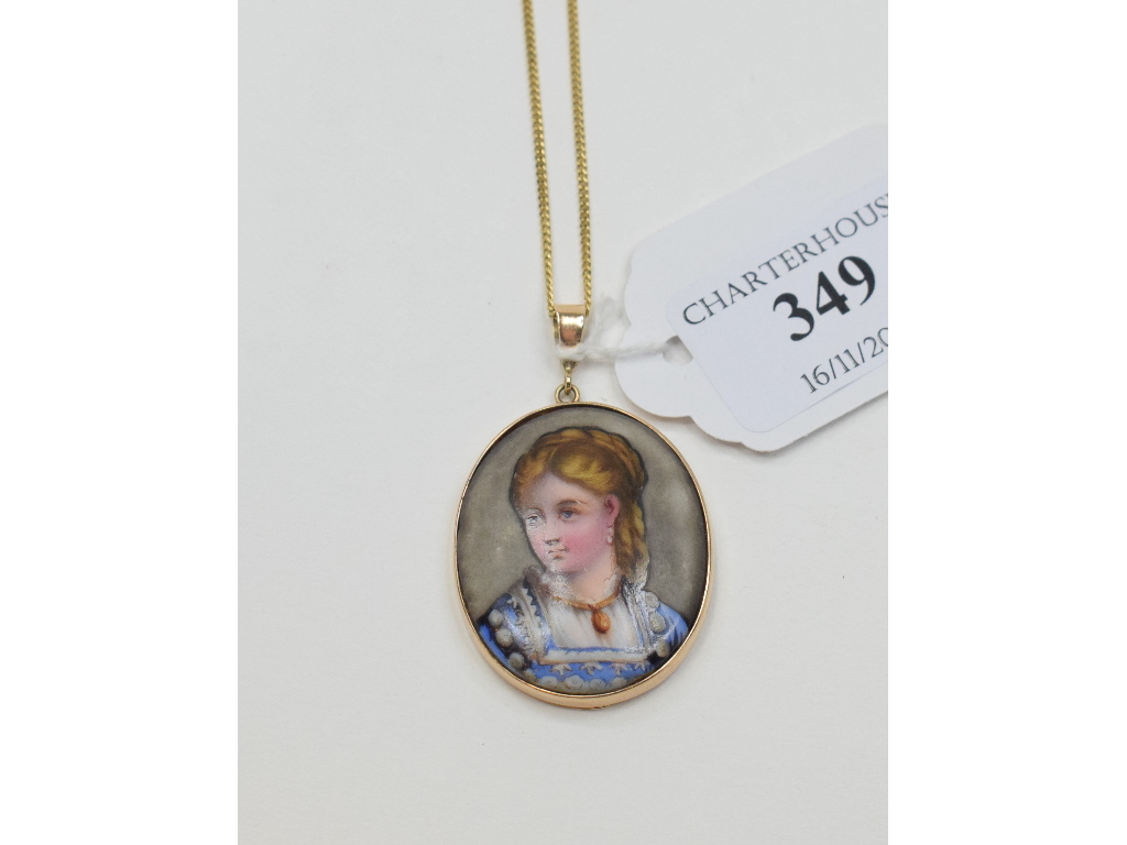 An oval portrait miniature, of a lady wearing a pendant, in a 9ct gold pendant mount,