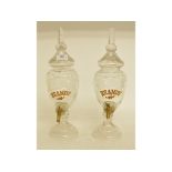 A pair of cut glass brandy dispensers,