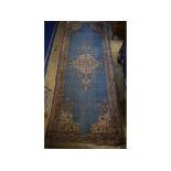 A Turkish Ushak carpet, with central medallion on a blue ground,