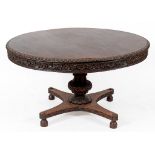 A 19th century Colonial centre table, with a carved freize,