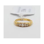 An 18ct gold and five stone diamond ring, approx.