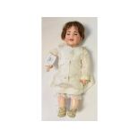 An SFBJ bisque head character baby doll, with sleeping blue eyes, incised SFBJ/236/PARIS/6,