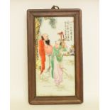 A Chinese porcelain panel, decorated two figures,