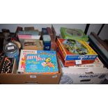Assorted board games and puzzles, including Monopoly,