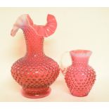 A cranberry and opalescent glass vase, with fluted rim, 26 cm high, and a similar jug,