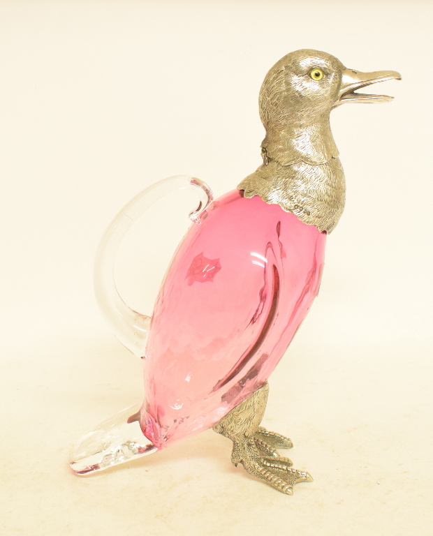 A novelty ruby glass decanter, with plated mounts, in the form of a duck,