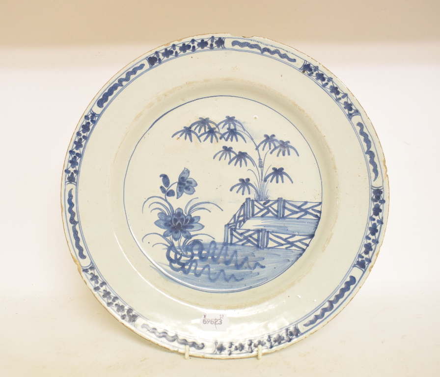 A Delft plate, decorated chickens, flowers and foliage, chipped and cracked, 34 cm diameter, - Image 2 of 3