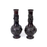 A pair of Japanese bronze vases, each de