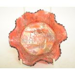 A ruby carnival glass bowl, decorated pa