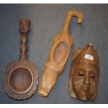 Assorted tribal items, including a carve