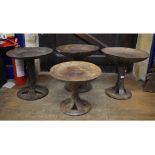 A set of four African tribal carved wood circular occasional tables, possibly Nagaland, 41 cm wide