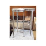 A pair of wrought iron circular stools,