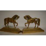 A pair of brass hearth ornaments, in the