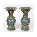 A pair of cloisonné vases, decorated flo