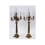 A pair of gilt four branch candelabra, w